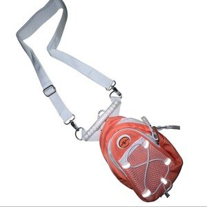 From Universal Studios Coral/ orange colored crossbody bag